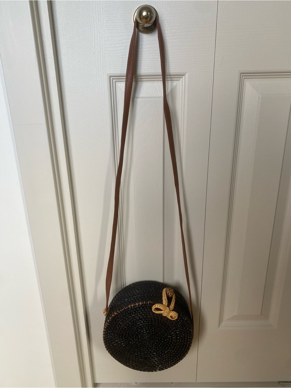 Black Round Woven Crossbody Bag with Gold Knot Accent